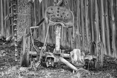 Old abandoned cart on field
