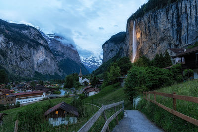 The view of lauterbrunnen and village town and staubbach waterfall taken in the morning. 