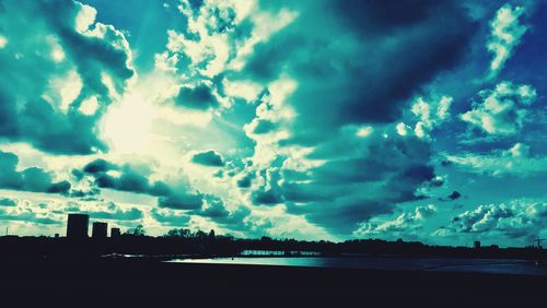 Scenic view of dramatic sky over city