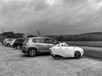 Cars on road against sky