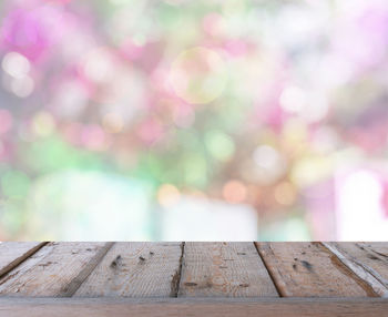 Close-up of wooden railing on pier