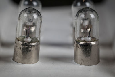 Close-up of light bulb on table