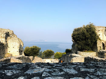 Scenic view of sea against clear blue sky