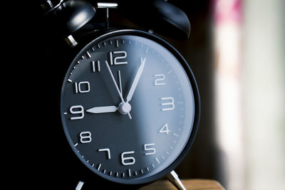 Close-up of clock on table