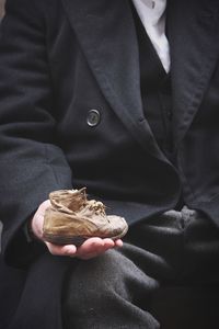 Close-up of hand holding ice cream