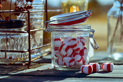 Vintage style handmade red and white striped old fashioned mint candy in glass jar