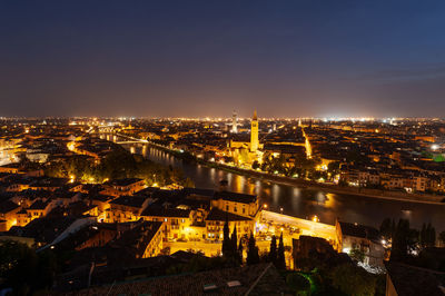 High angle view of illuminated buildings in city at night