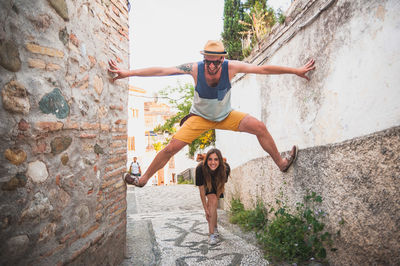 Full length of woman jumping in mid-air