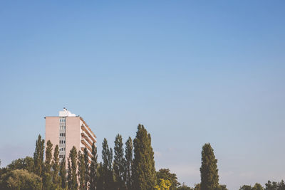 Low angle view of built structure against clear blue sky