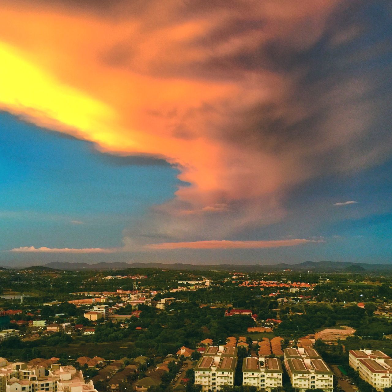 building exterior, architecture, built structure, cityscape, city, sky, cloud - sky, residential district, crowded, high angle view, residential structure, residential building, cloud, cloudy, sunset, house, aerial view, outdoors, town, city life