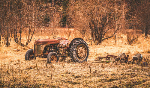 Abandoned tractor on field