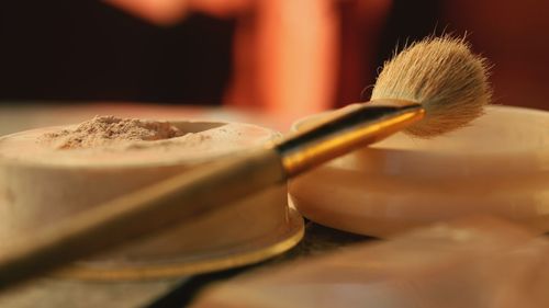 Close-up of make-up brush and powder