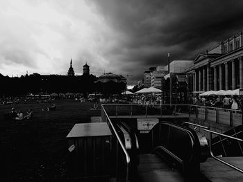 Buildings against cloudy sky