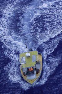 High angle view of ship sailing in sea