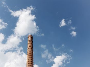 Low angle view of smoke stack against sky