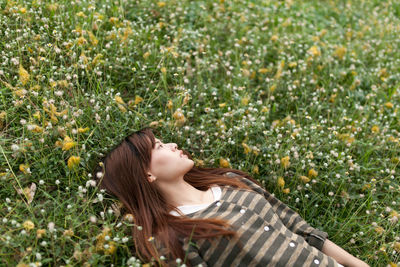 Woman lying down on field