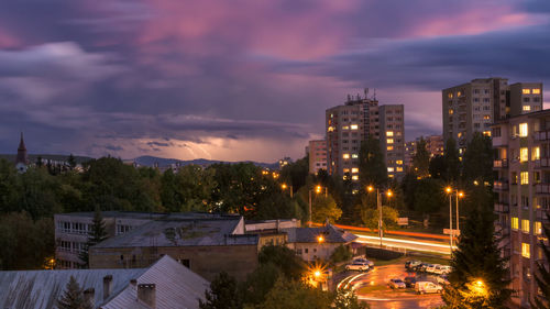 High angle view of illuminated buildings against sky at sunset