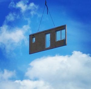 Low angle view of built structure against blue sky