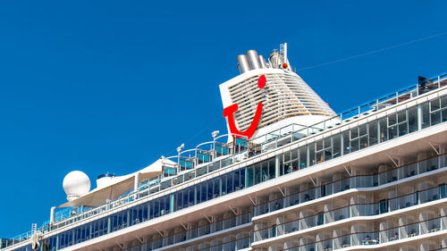 Low angle view of modern building against clear blue sky