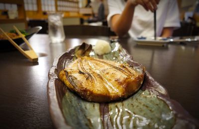 Close-up of fish in plate on table