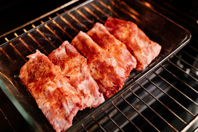 High angle view of meat on barbecue grill