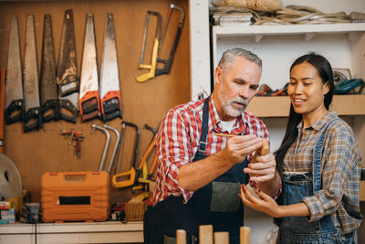 Portrait of colleagues working in workshop