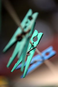 Close-up of clothespins on clothesline