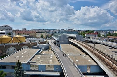 High angle view of road by buildings against sky