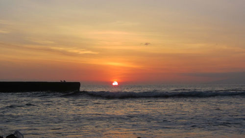 Scenic view of sunset over sea