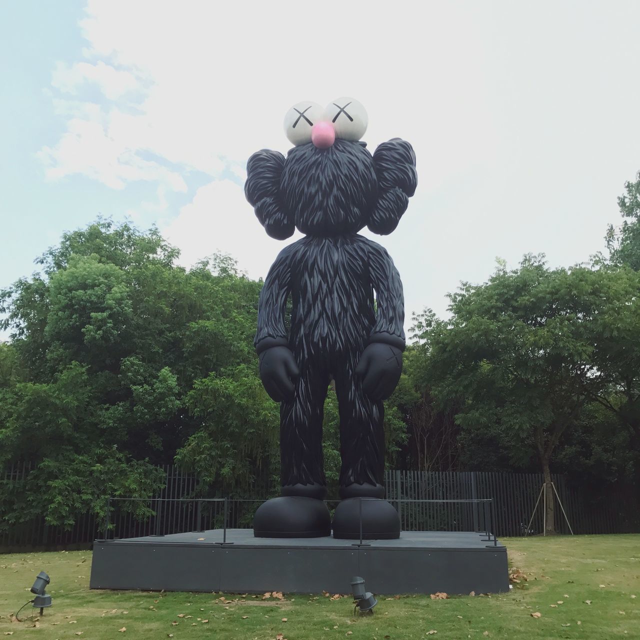 sculpture, tree, statue, human representation, park - man made space, day, sky, outdoors, no people, growth, low angle view, nature