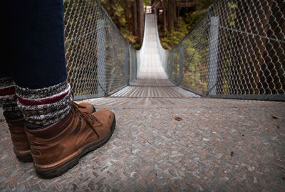 Low section of man standing on footpath