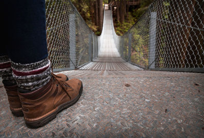 Low section of man standing on footpath