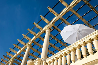 Low angle view of built structure against blue sky