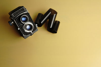 Close-up of camera over black background