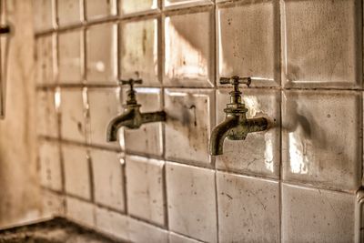 Close-up of faucet in bathroom