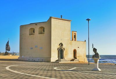 View of historical building against clear blue sky