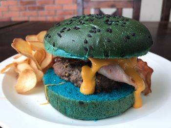 Close-up of burger in plate on table