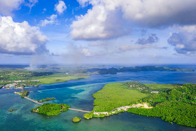 High angle view of island against cloudy sky