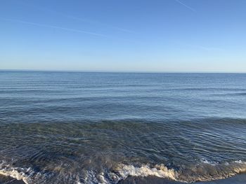 Scenic view of sea against clear blue sky