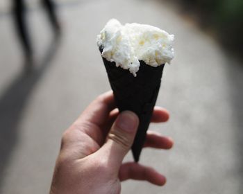 Close-up of hand holding ice cream