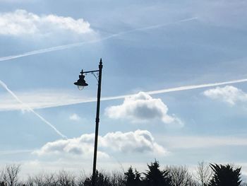 Low angle view of vapor trail against sky