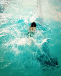 High angle view of person swimming in pool