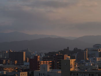 Cityscape against sky during sunset