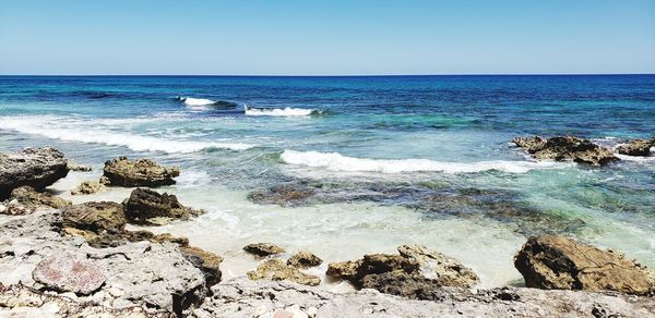 Scenic view of sea against clear sky