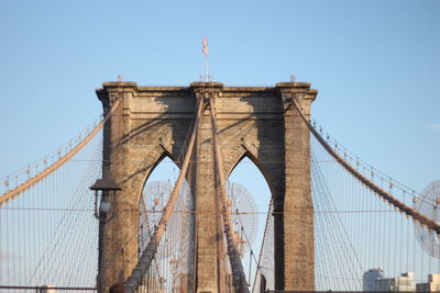 Low angle view of brooklyn bridge against clear sky