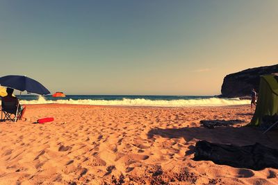 Scenic view of beach against clear sky