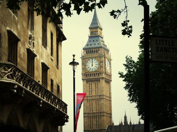 architecture, building exterior, built structure, low angle view, famous place, tower, travel destinations, clock tower, international landmark, capital cities, travel, city, tourism, clear sky, tall - high, history, religion, spire, clock, tree