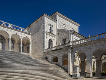 Low angle view of building against blue sky