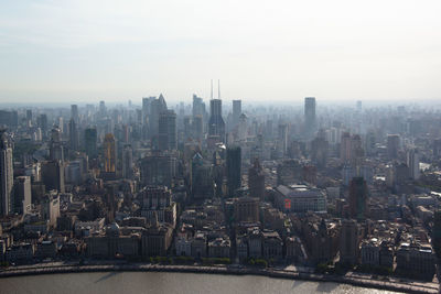 Aerial view of modern buildings in city against sky