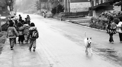 Woman walking on road